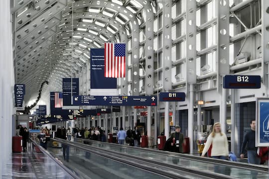 People walking through an airport