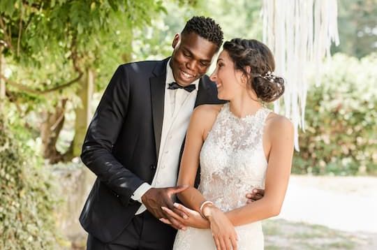 A couple celebrating with wedding guests